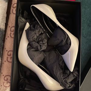 Like-new  eggshell color Yves Saint Laurent size 38 with “YSL” heel.